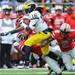 Michigan senior quarterback Denard Robinson busts through a tackle to take the ball to the end zone in the second quarter at Ohio Stadium on Saturday. Melanie Maxwell I AnnArbor.com